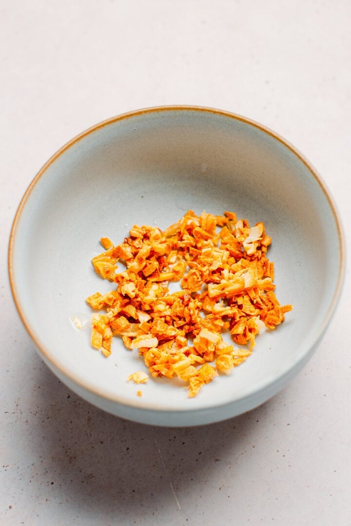 Fried garlic in a small bowl.