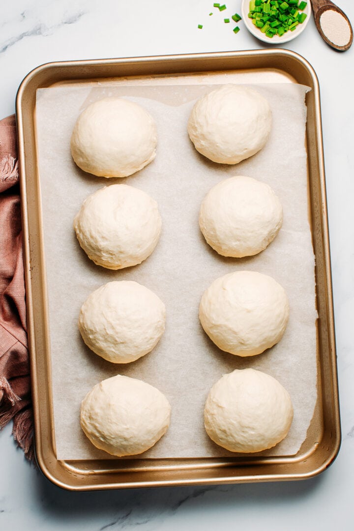 Round balls of dough on a baking sheet.