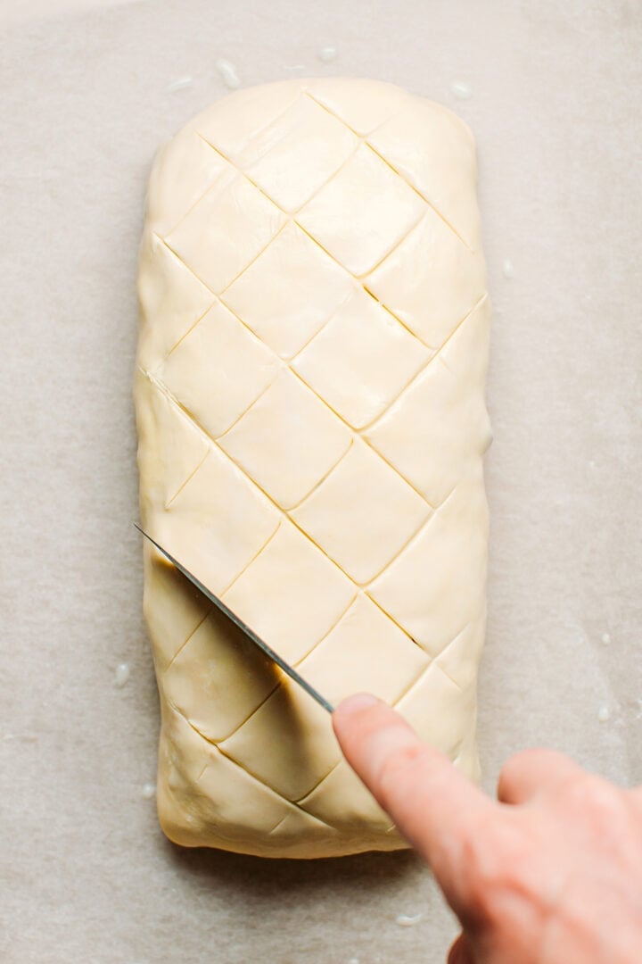 Cutting a pattern on top of a Wellington.