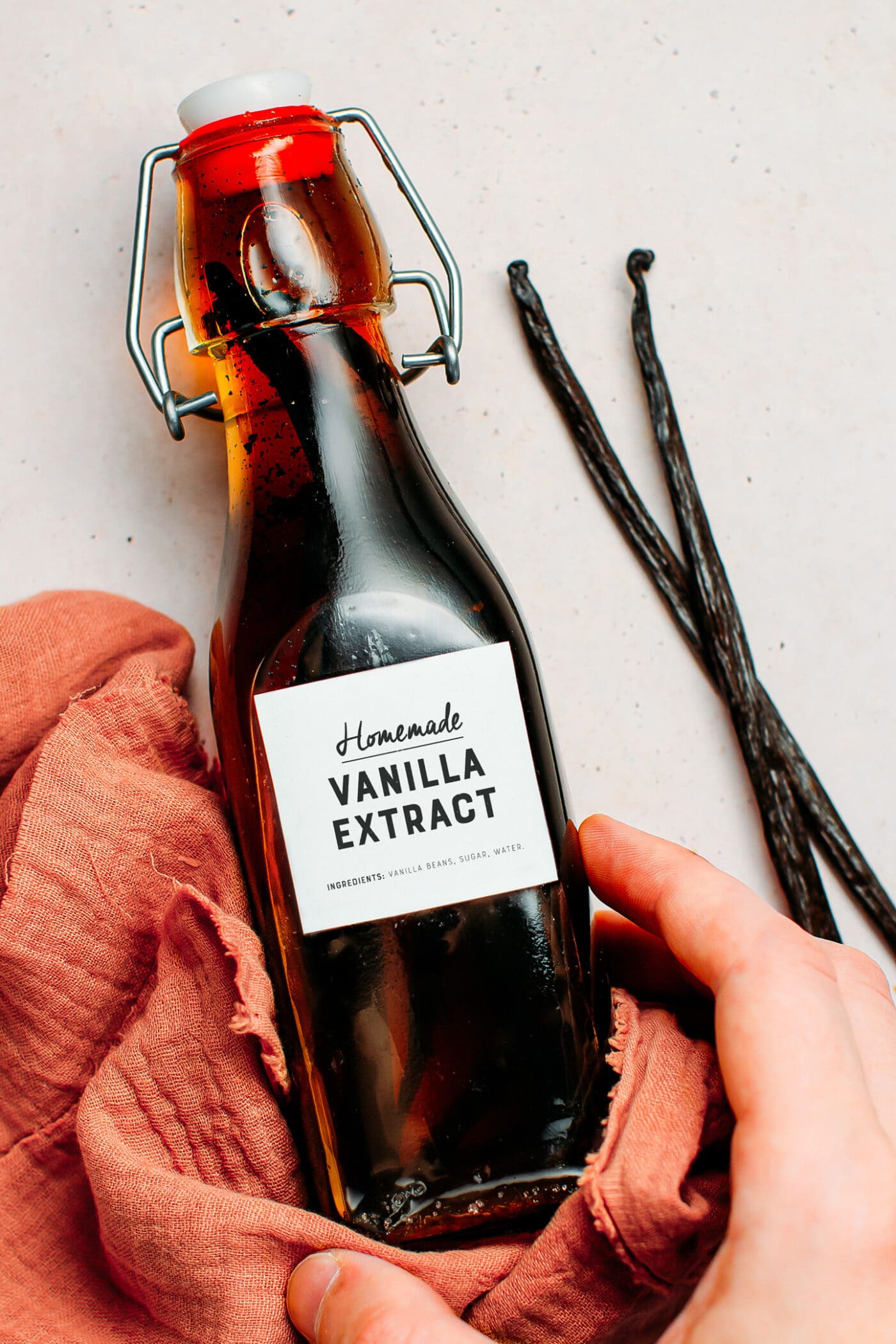 Bottle of homemade vanilla extract with vanilla beans.