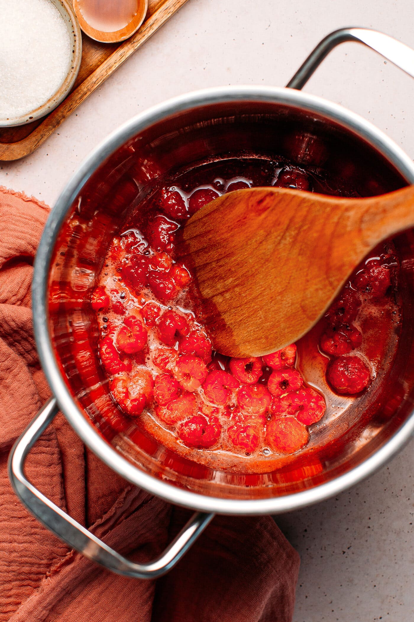 Cooked raspberries in a pot.