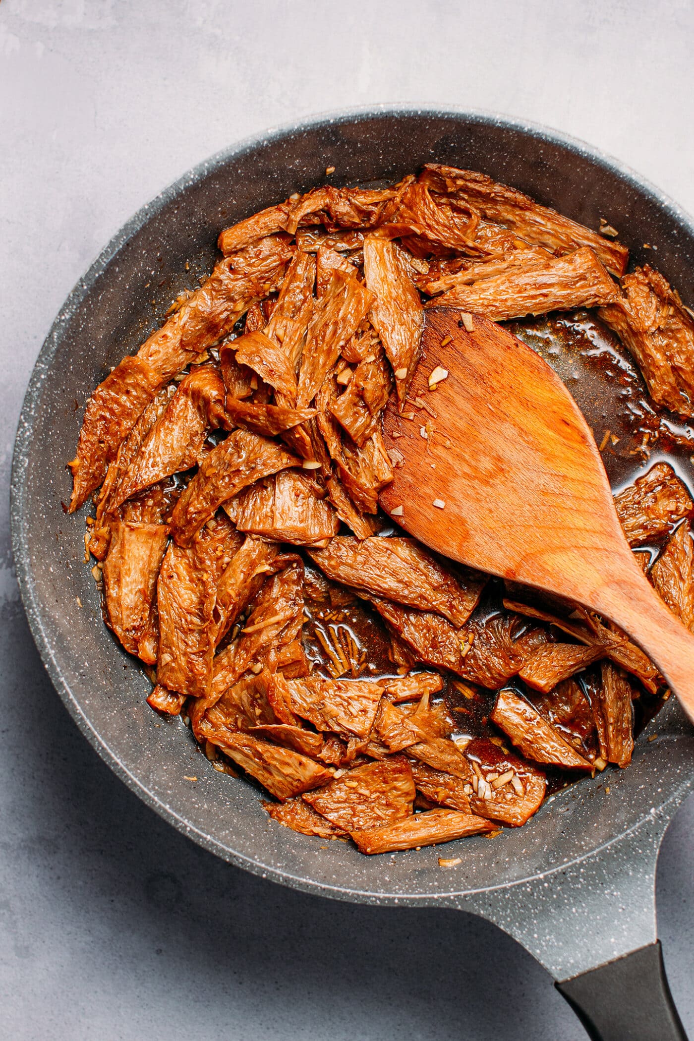 Sautéed vegan beef in a skillet.