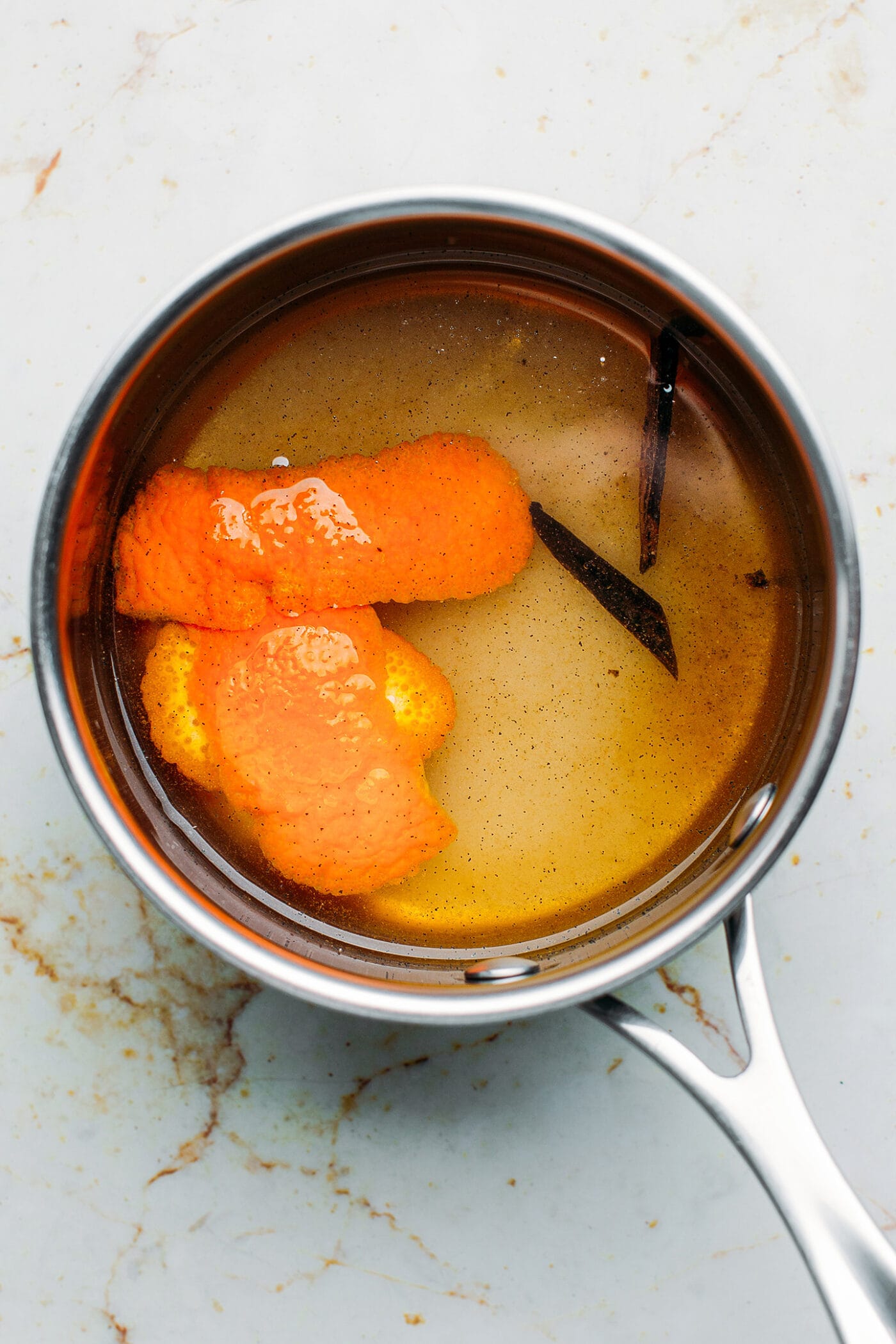 Rum syrup with orange peels and vanilla beans.