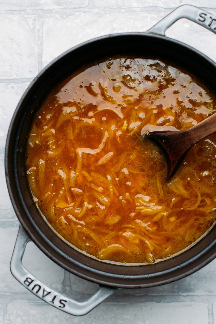 French onion soup in a pot.