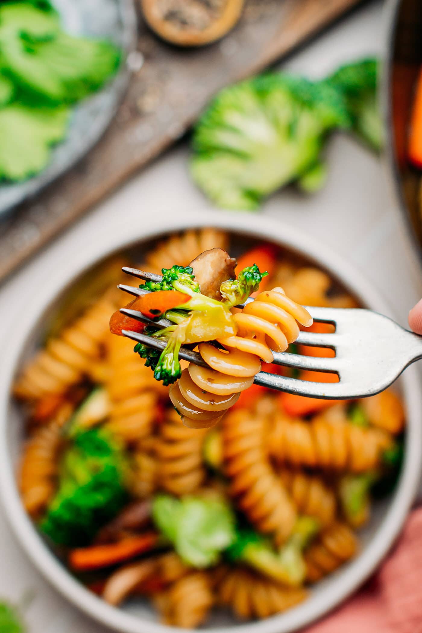 Close-up of fusilli stir-fry with broccoli.