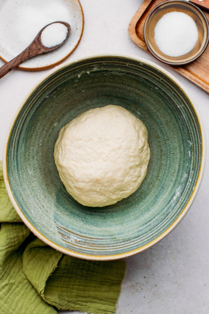 Ball of dough in a mixing bowl.