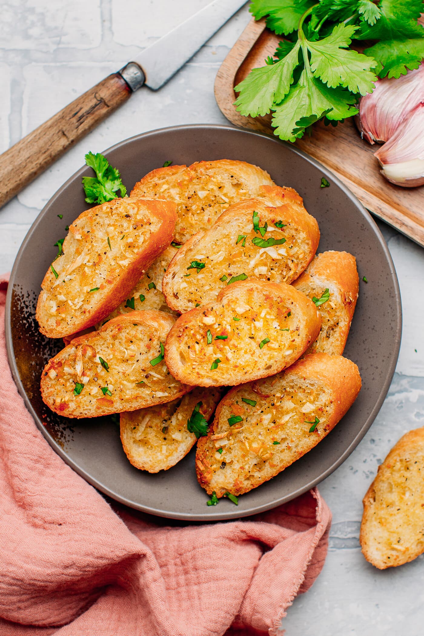 Slices of garlic bread on a plate.