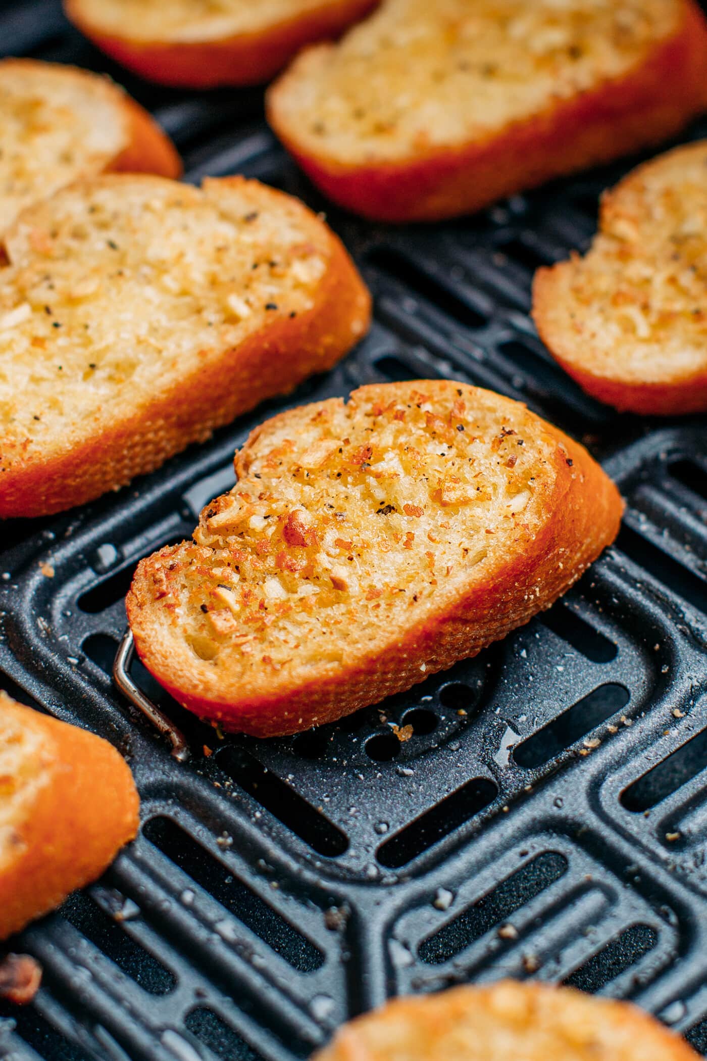 Close-up of a slice of garlic bread.