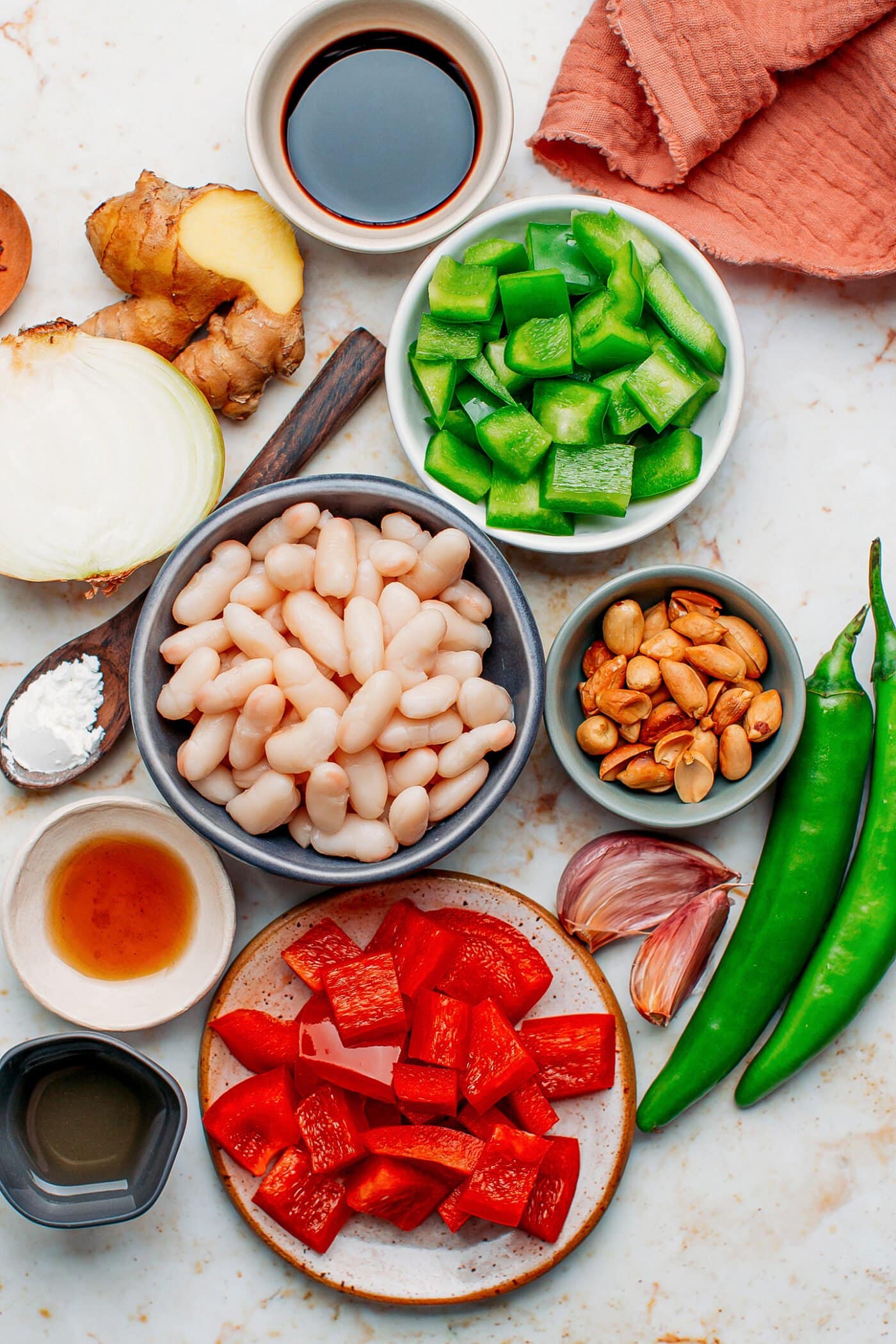 Ingredients like white beans, garlic, jalapeno peppers, soy sauce, and ginger.