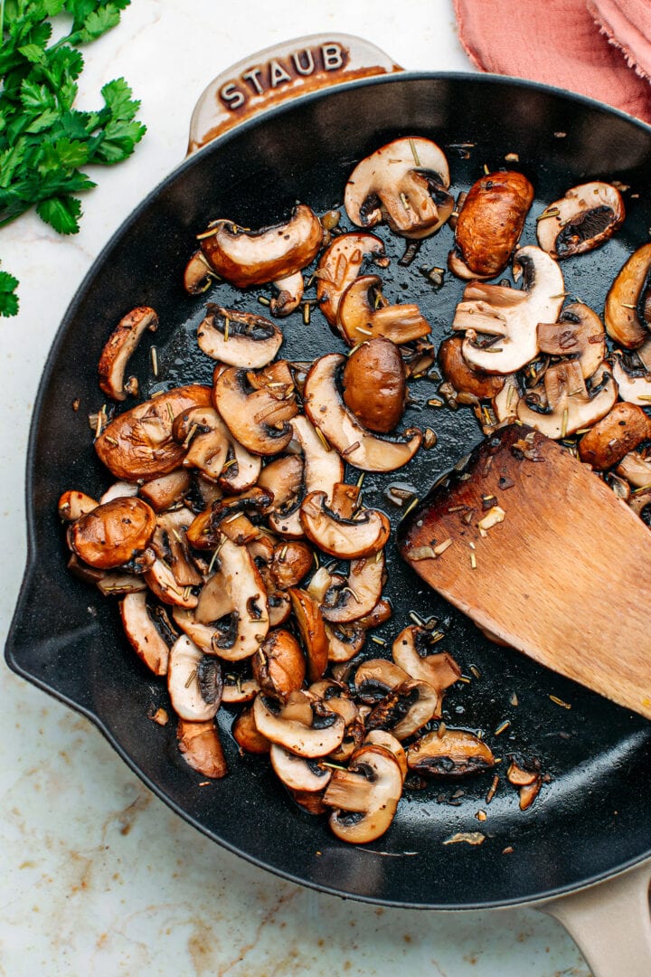 Sautéed mushrooms in a skillet.