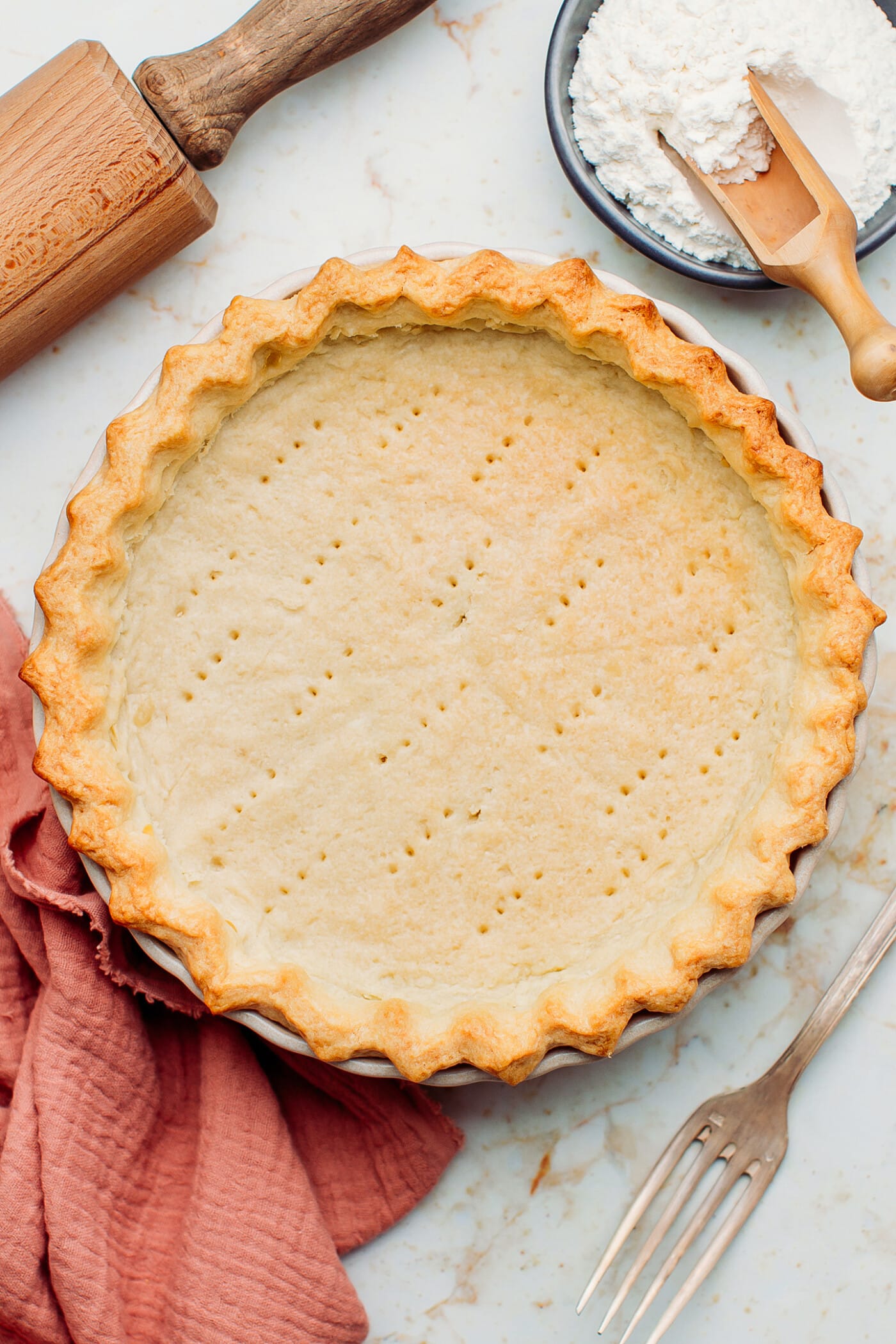 Blind baked pie crust in a pie plate.