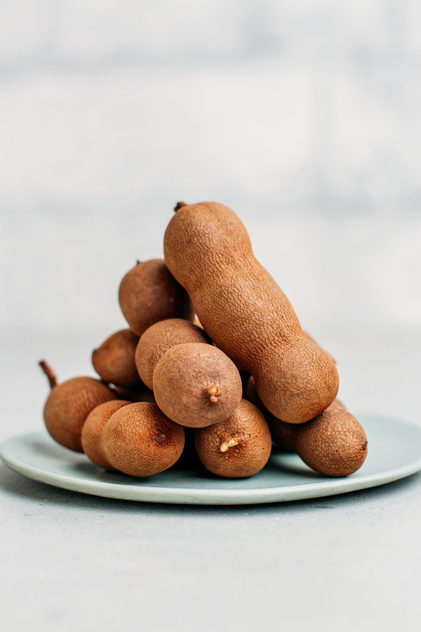 Tamarind pods on a plate.