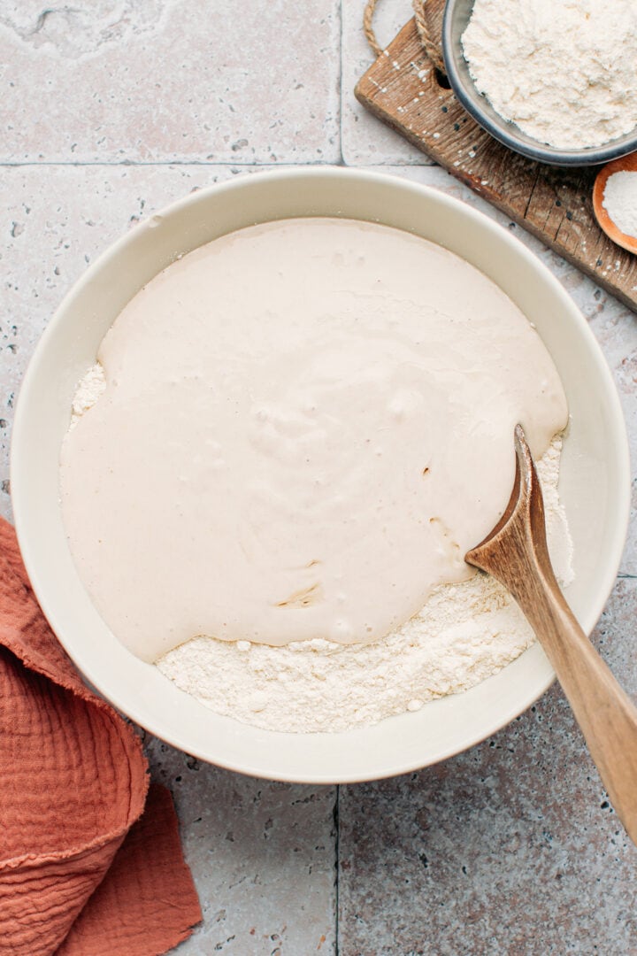 Flour and blended bananas in a mixing bowl.