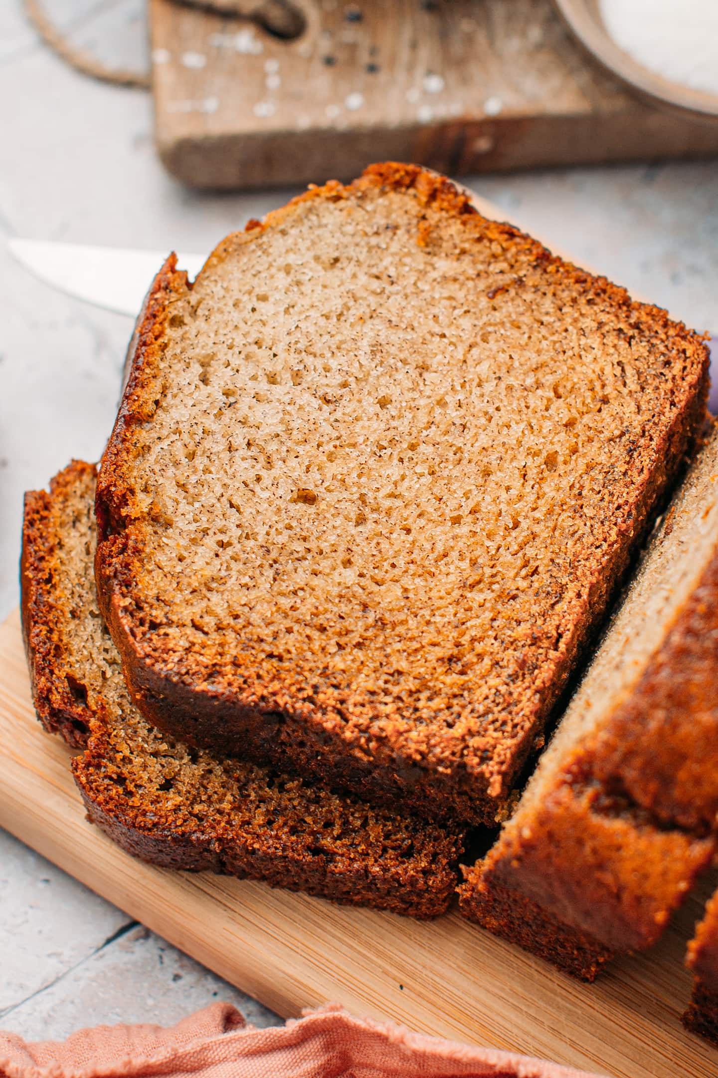 Slices of banana bread on a cutting board.