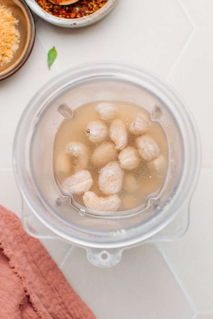 Raw cashews and water in a blender.