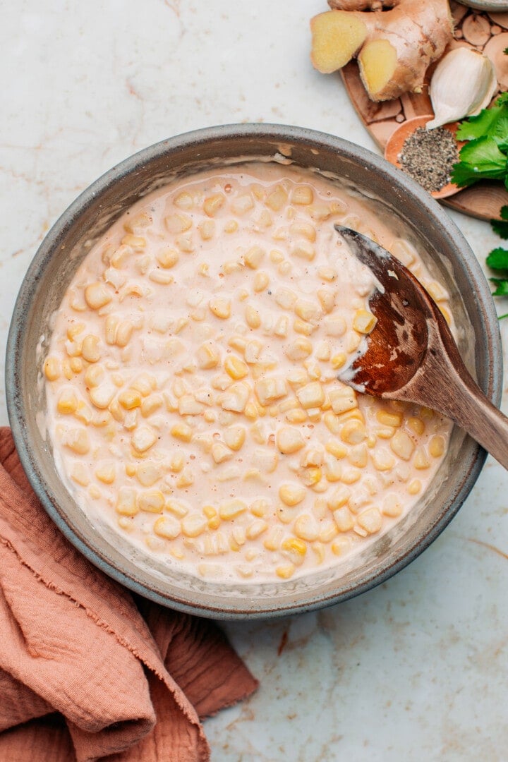 Batter with corn kernels in a bowl.