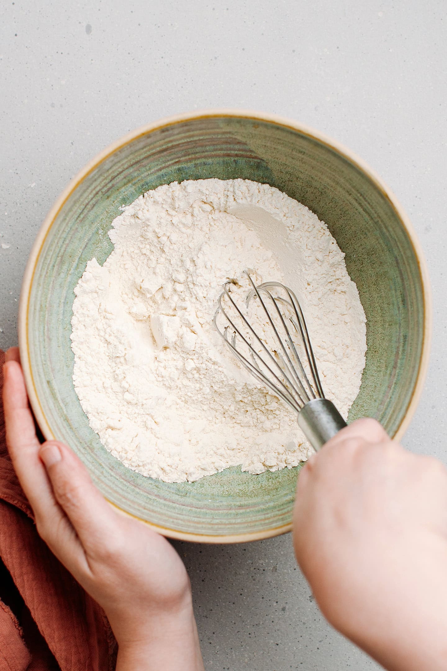 Whisking four, sugar, and baking powder.