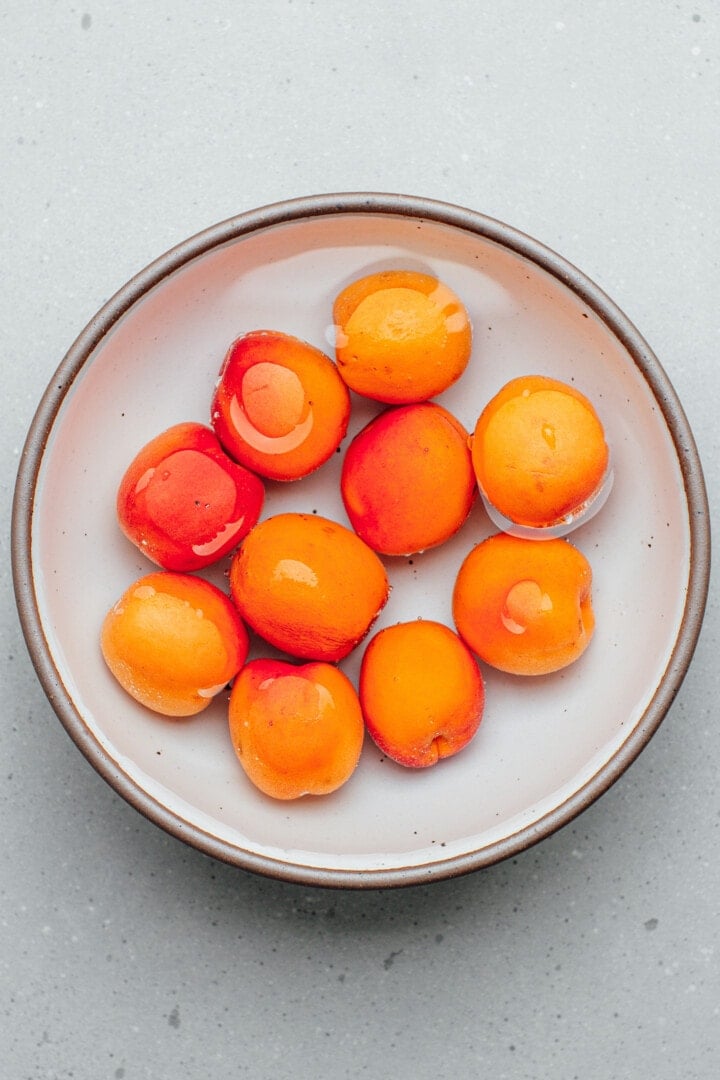 Apricots soaking in water.