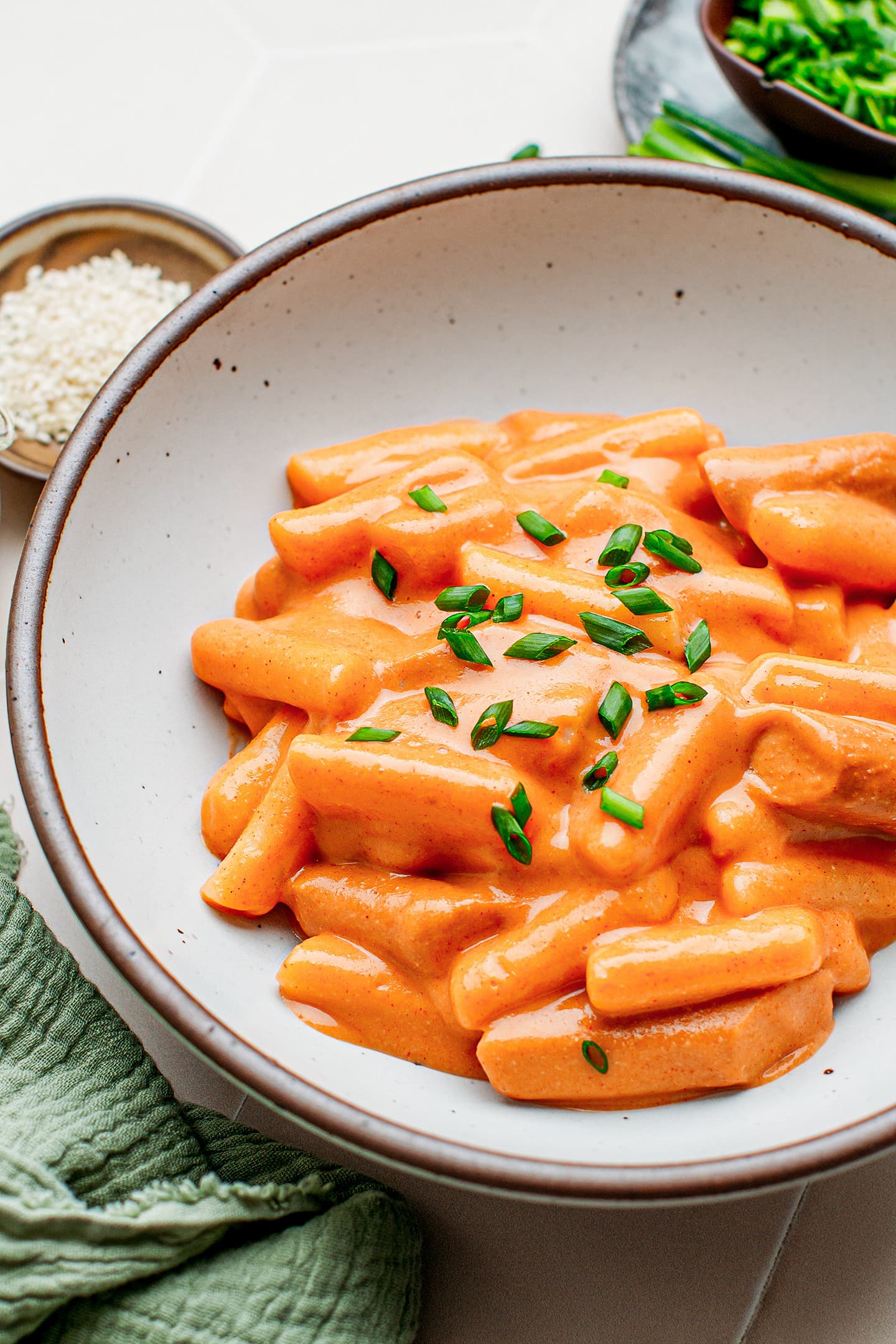 Close-up of Tteokbokki topped with green onions.