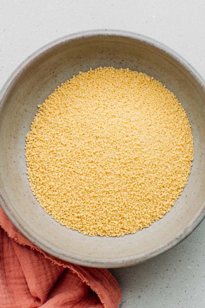 Dried couscous in a bowl.