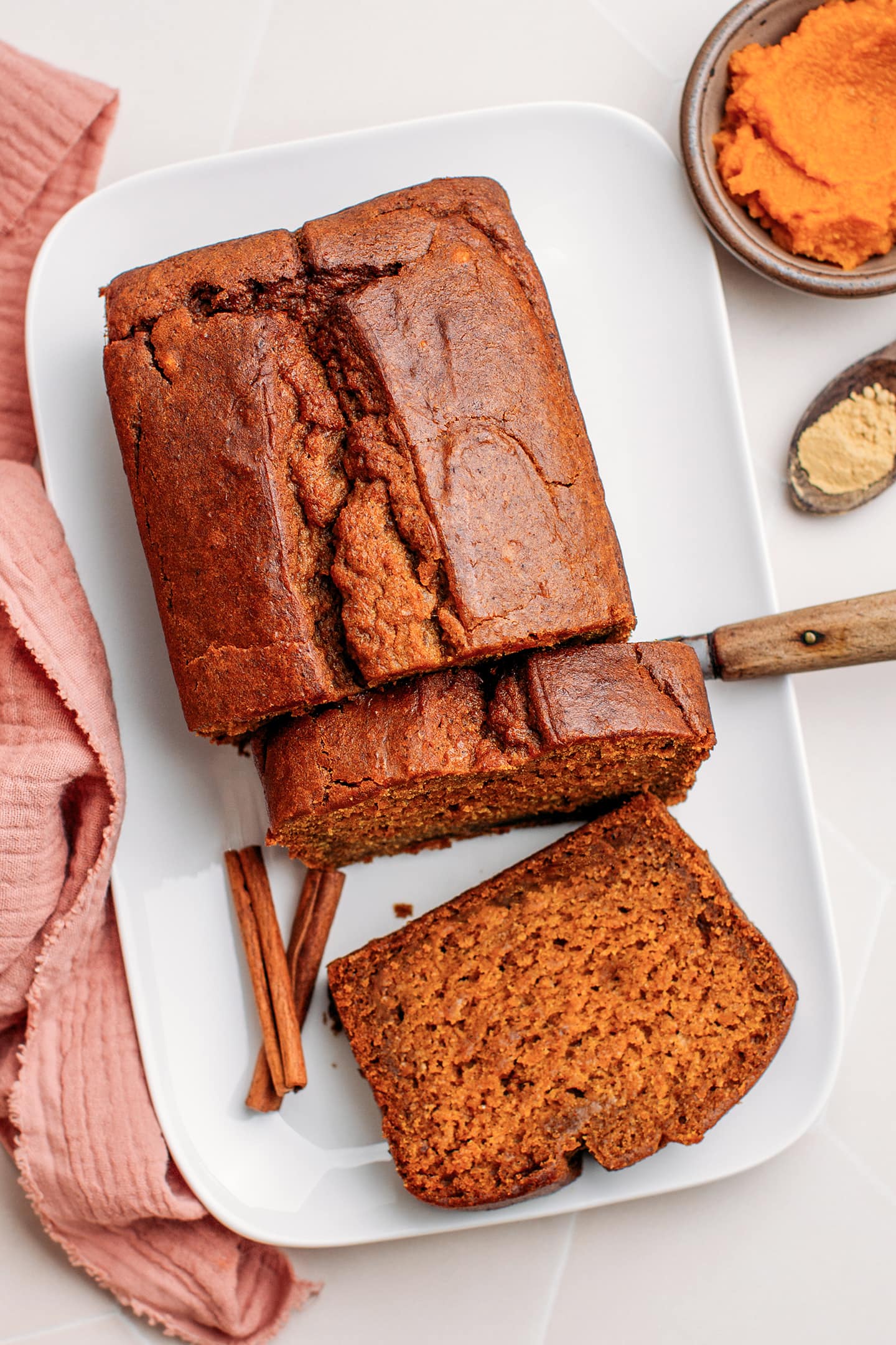 Sliced pumpkin bread on a dish.