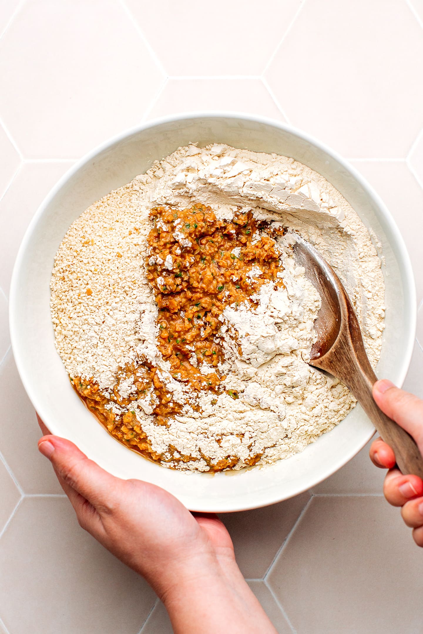 Mixing soy curls, beans, and wheat gluten.