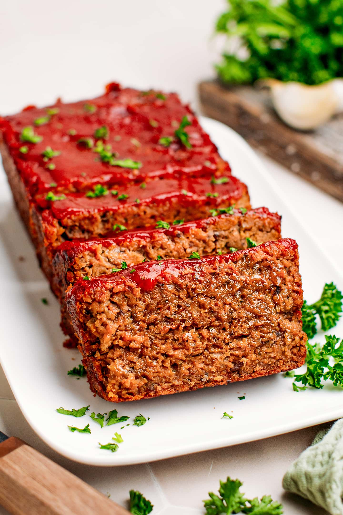 Sliced vegan meatloaf with ketchup glaze.