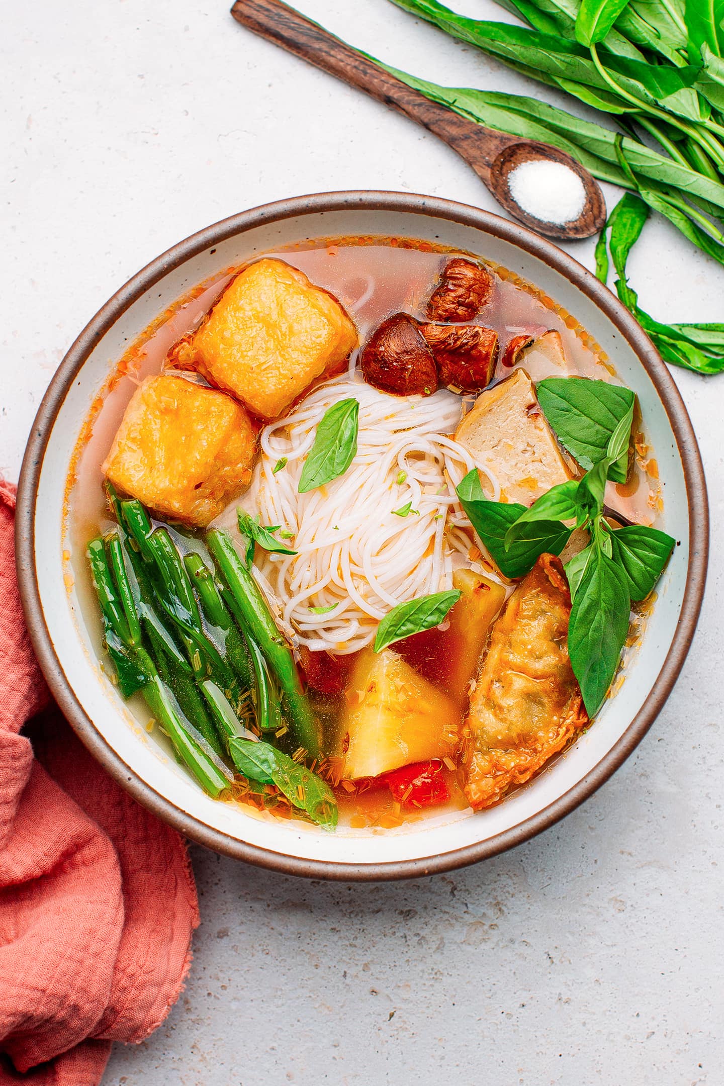 Sweet and sour noodle soup with tofu, mushrooms, and pineapple.