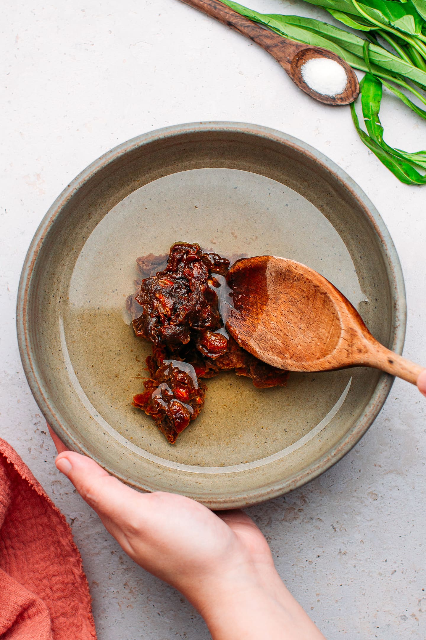 Tamarind pulp and water in a bowl.