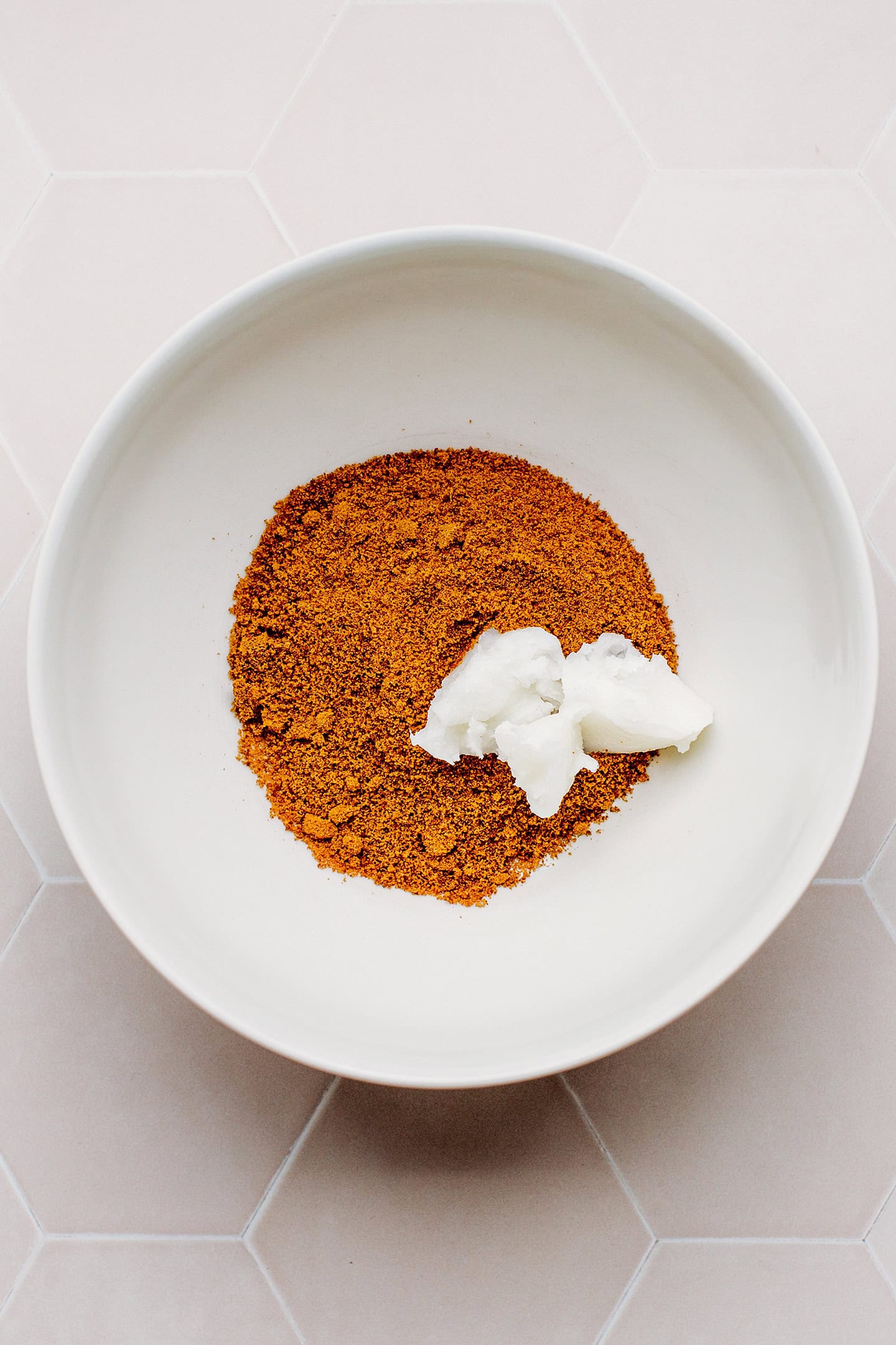 Coconut oil and coconut sugar in a mixing bowl.