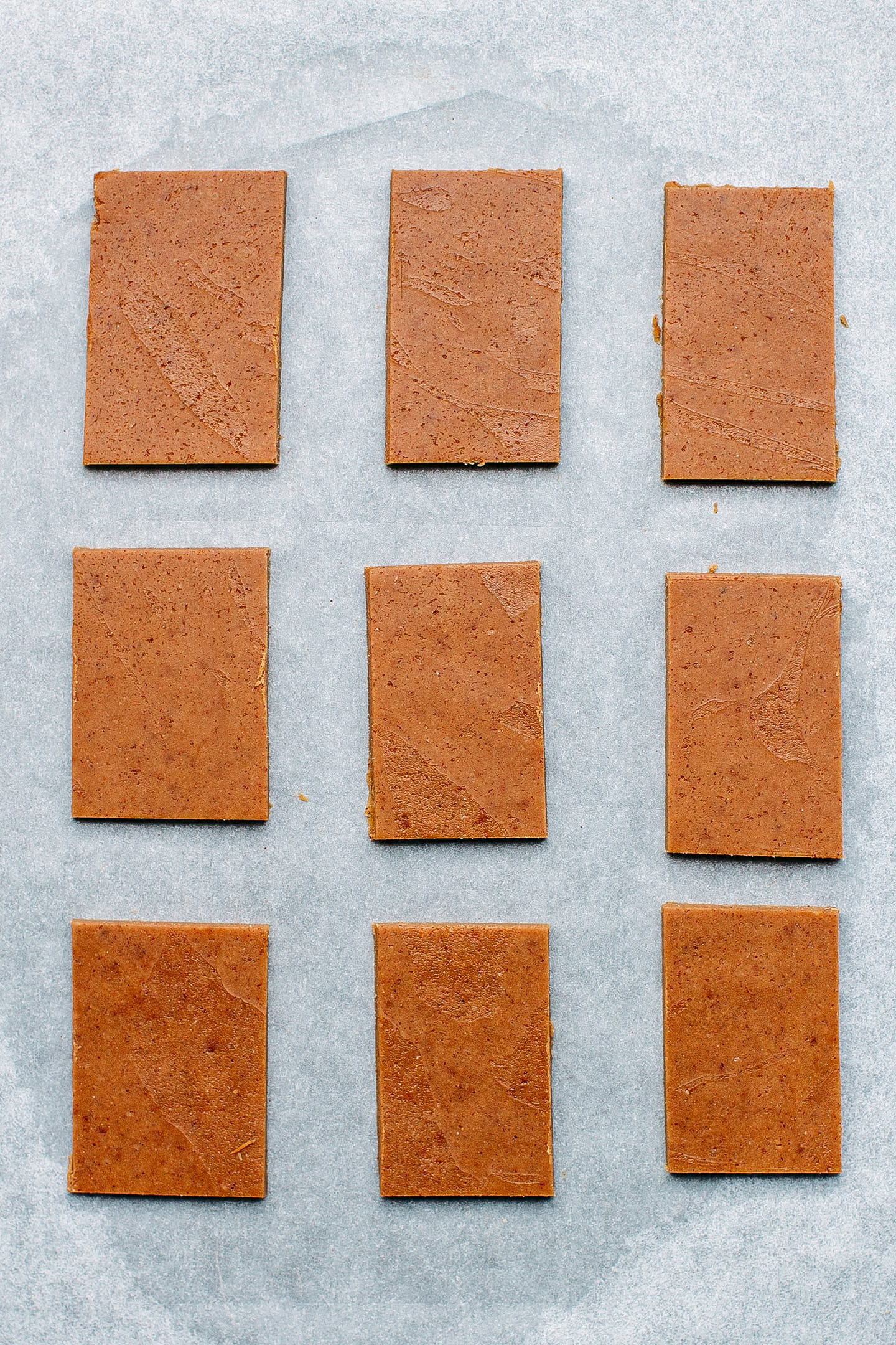 Uncooked biscoff cookies on a baking sheet.