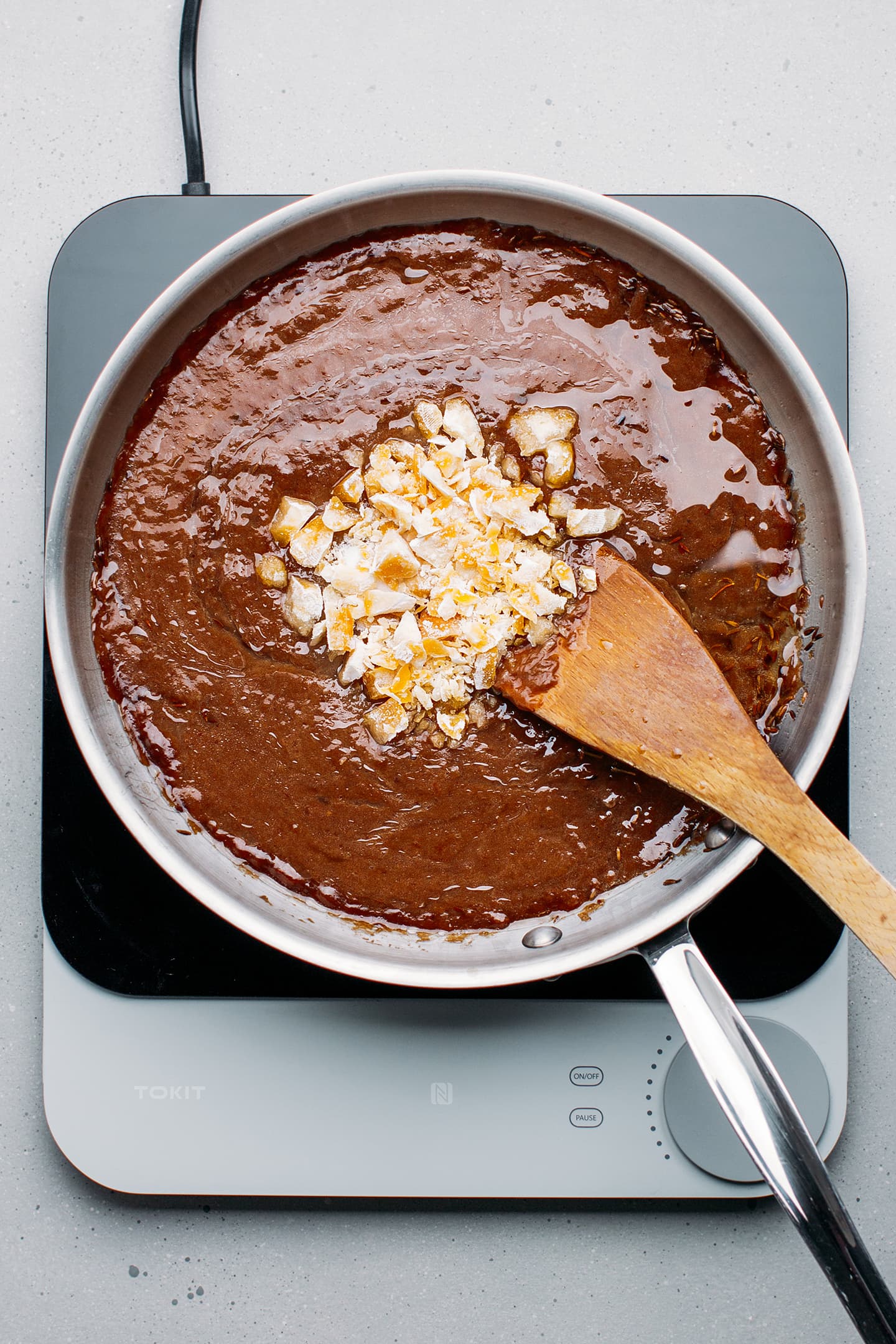 Tamarind paste and rock sugar in a skillet.