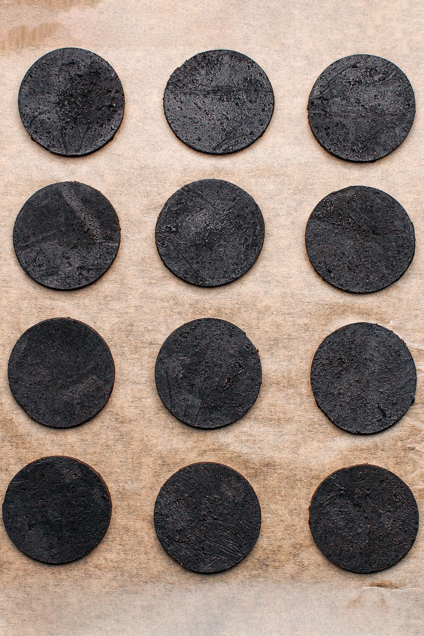 Unbaked chocolate cookies on a baking sheet.