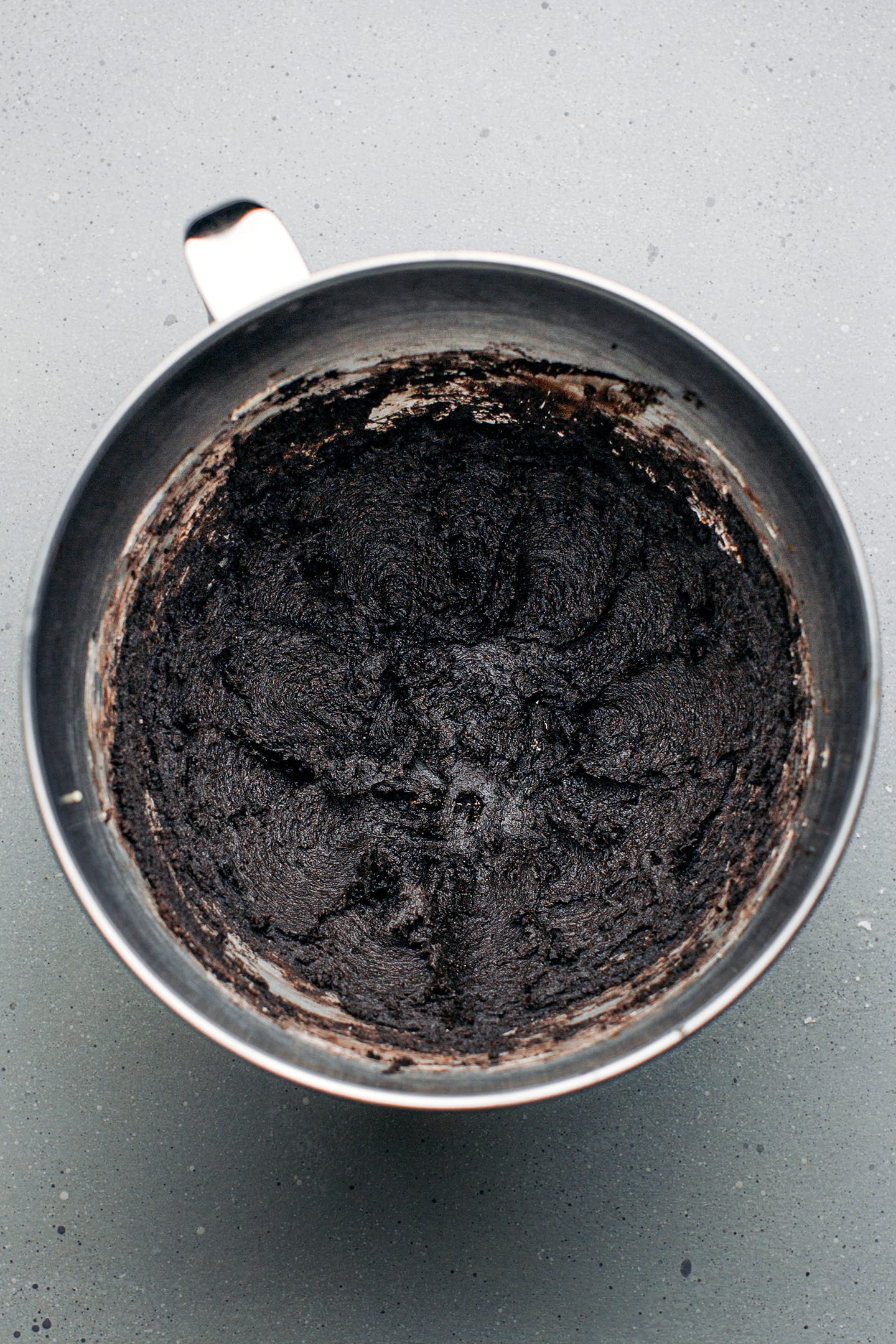 Oreo cookie dough in a mixing bowl.