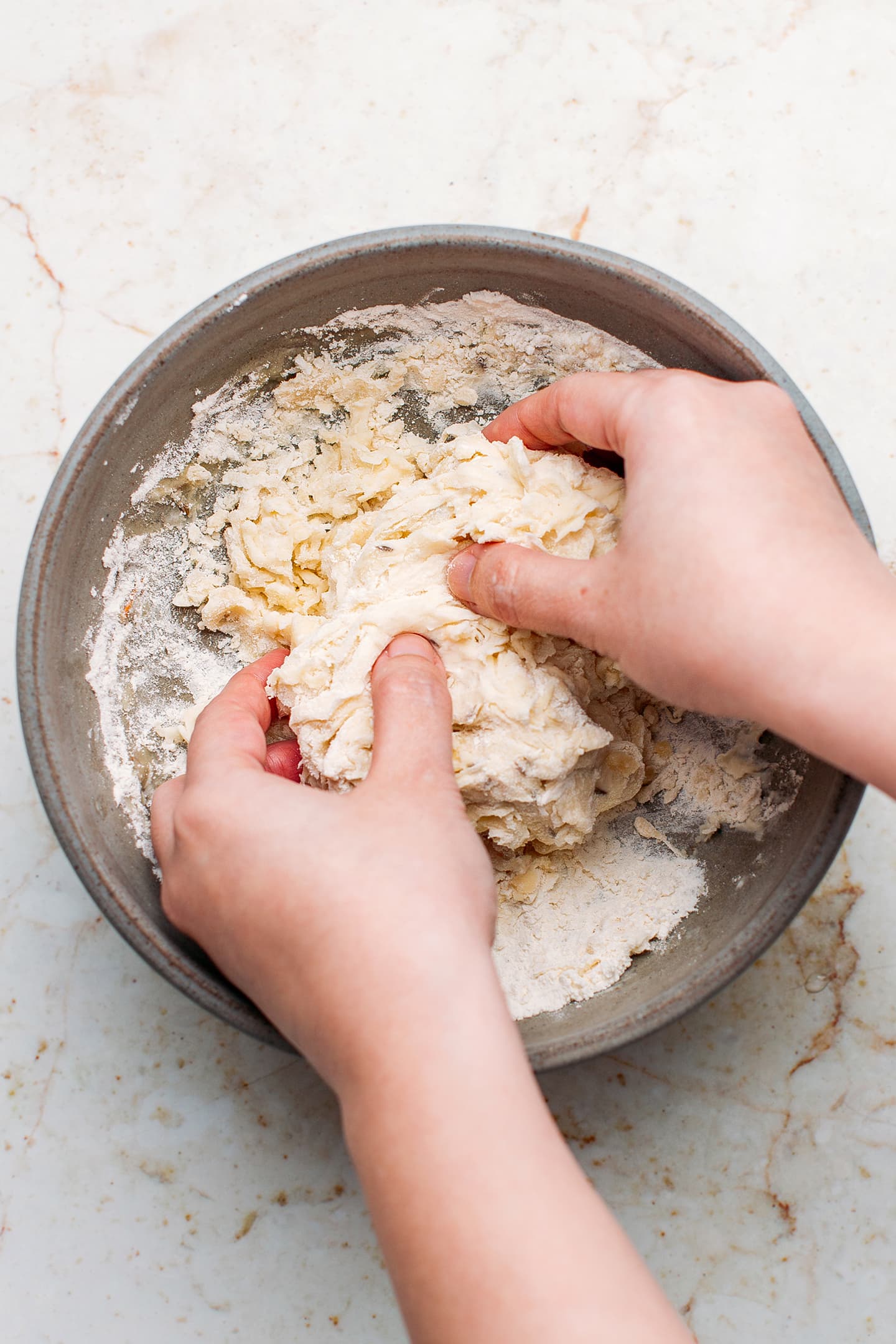 Kneading flour with water and oil.