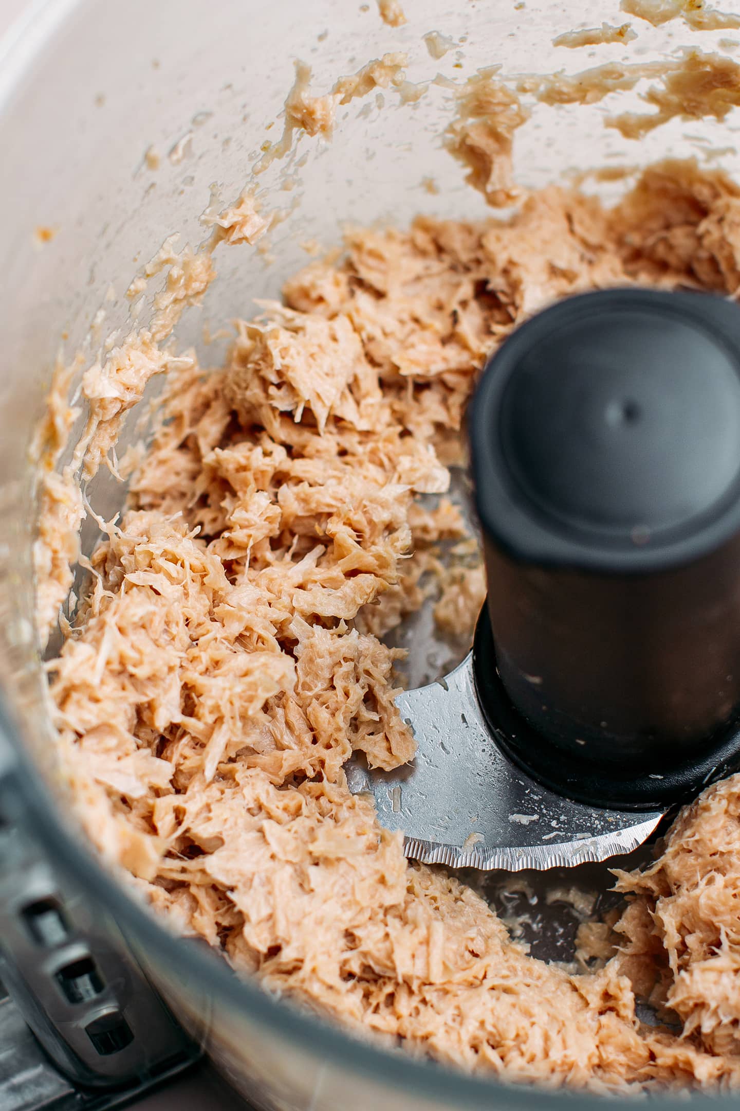 Shredded vegan tuna in a food processor.