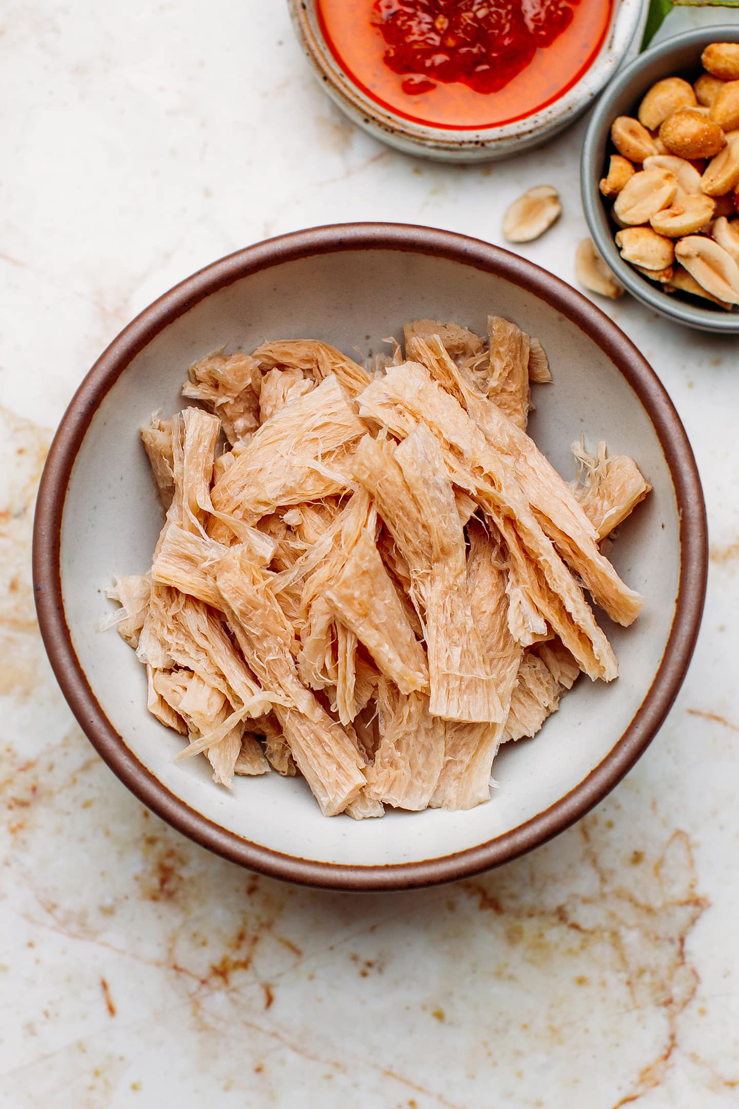 Shredded TVP in a bowl.