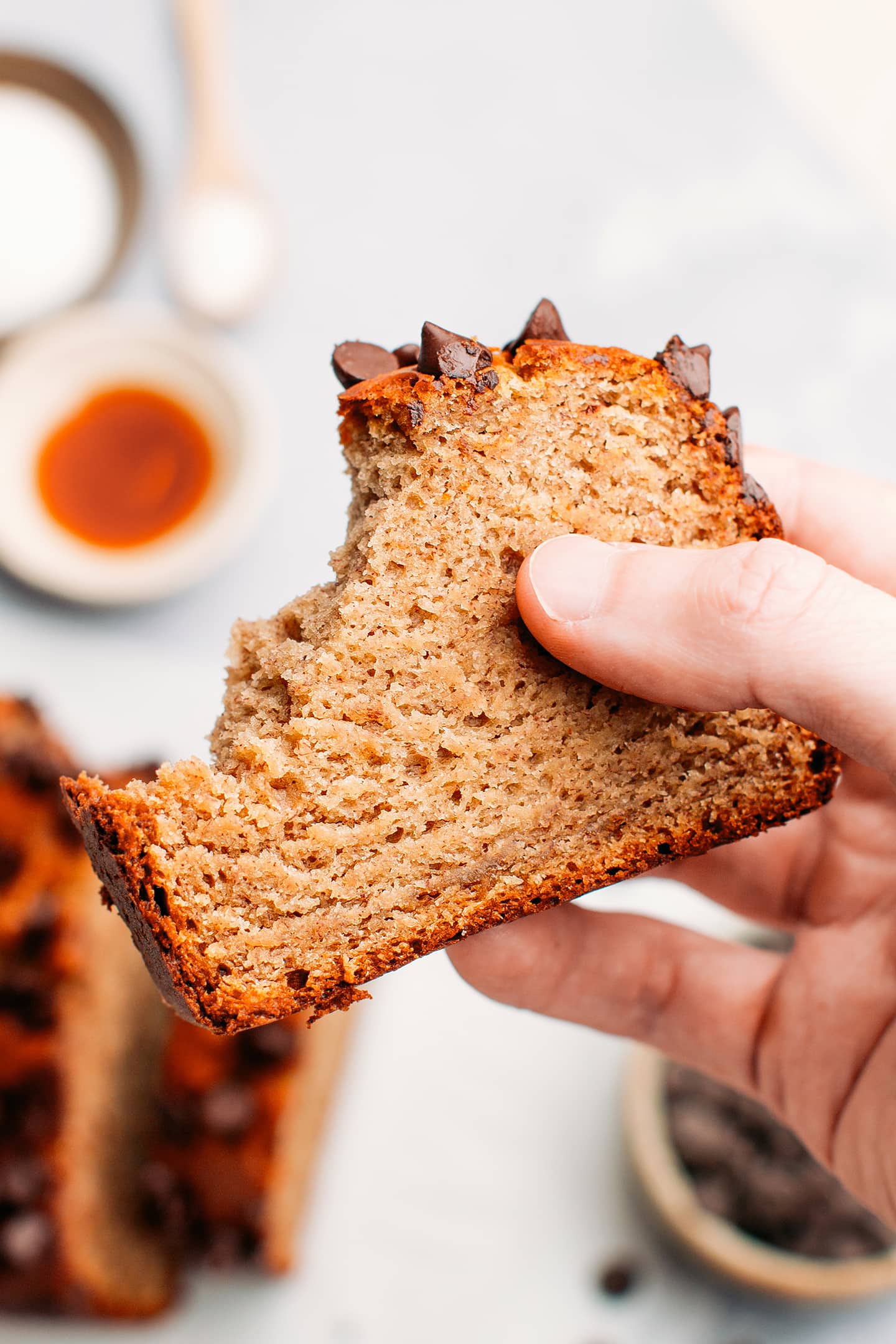 Holding a slice of protein banana bread.