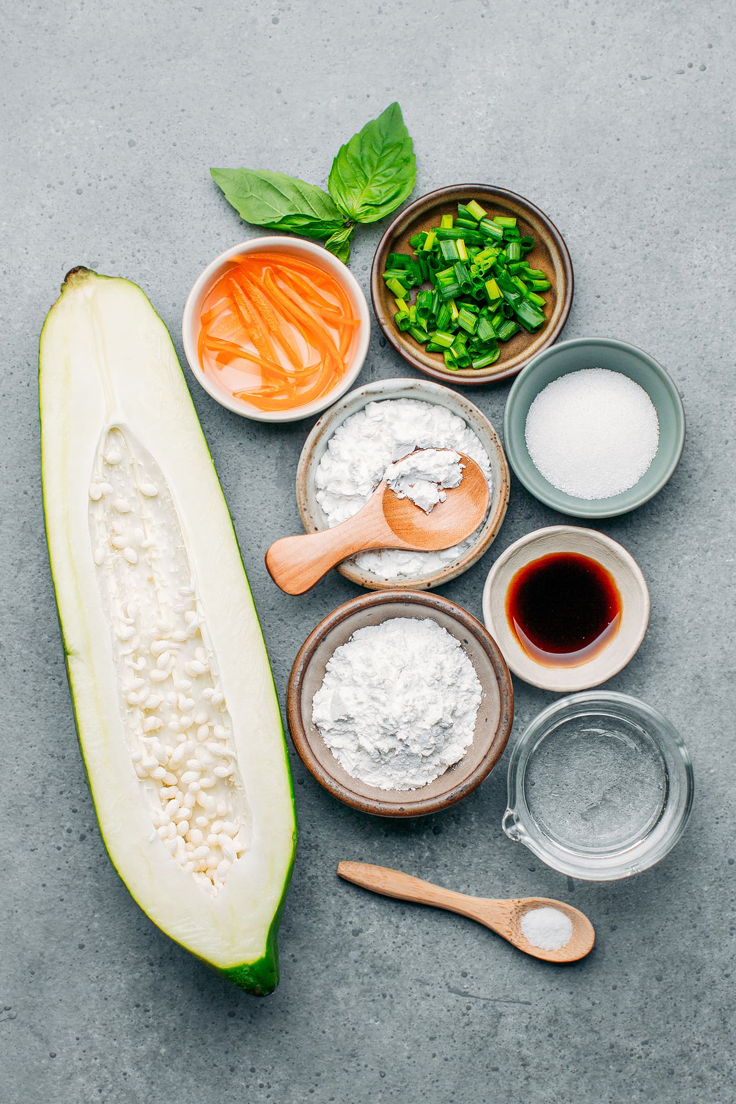 Ingredients like green papaya, rice flour, green onions, and soy sauce.