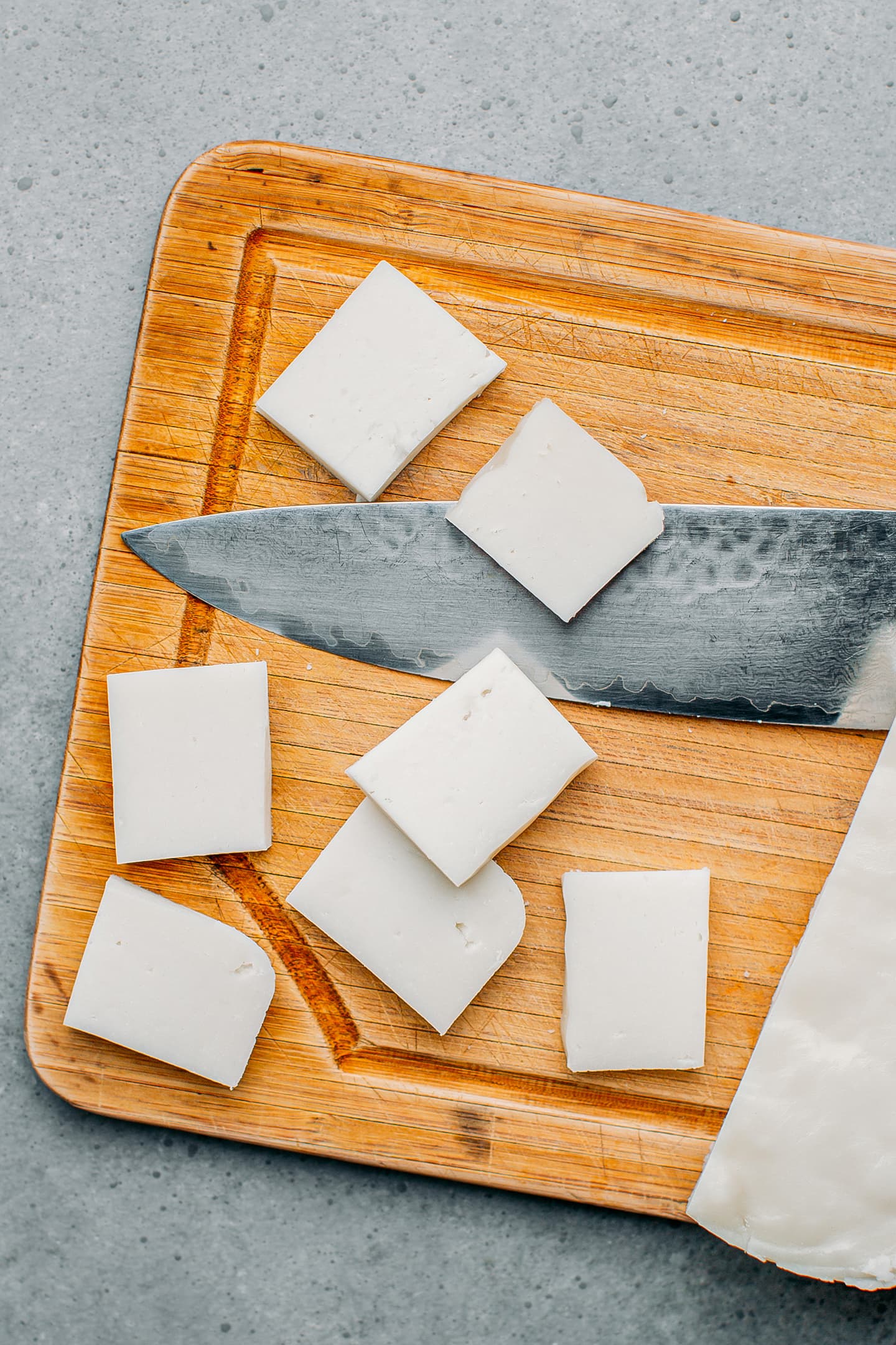 Sliced rice cakes on a cutting board.