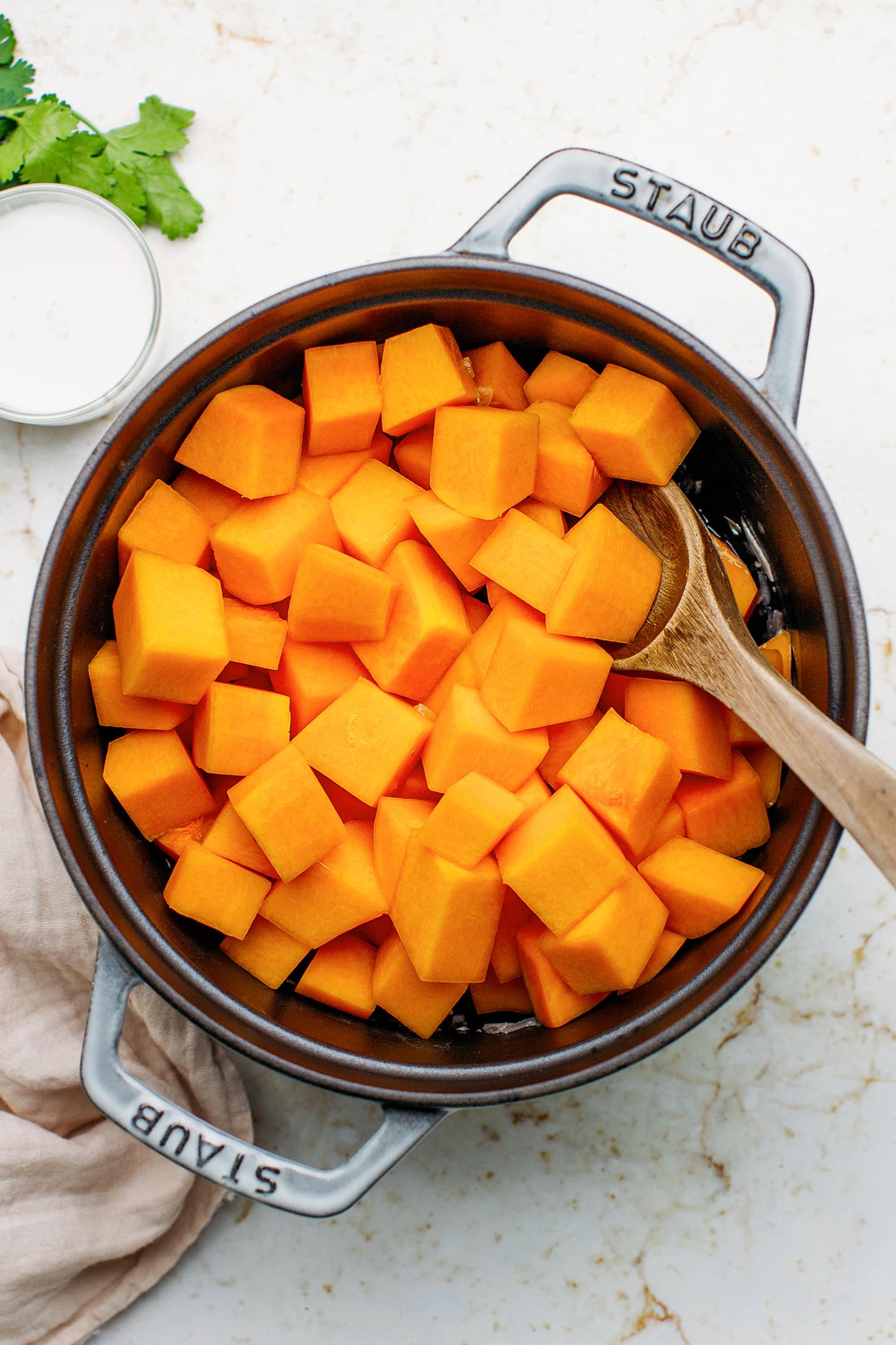 Cubed butternut squash in a pot.