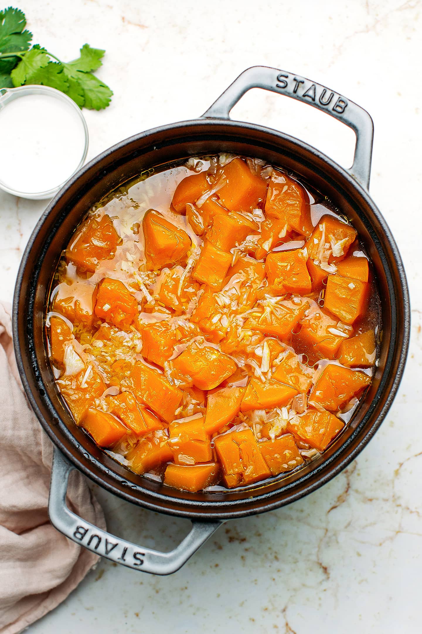 Cooked butternut squash in a pot.