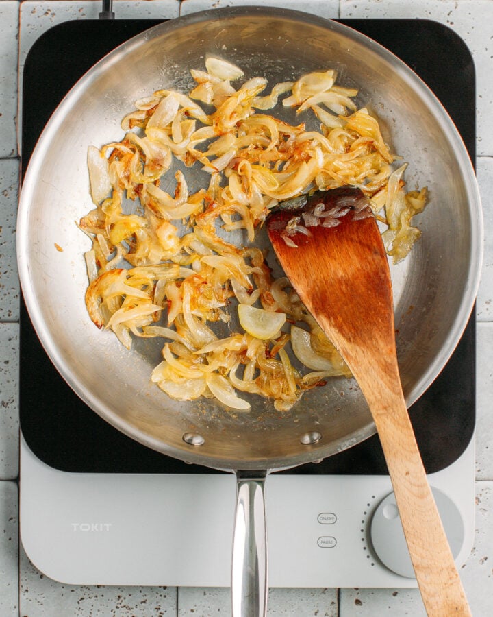 Golden brown onions in a skillet.