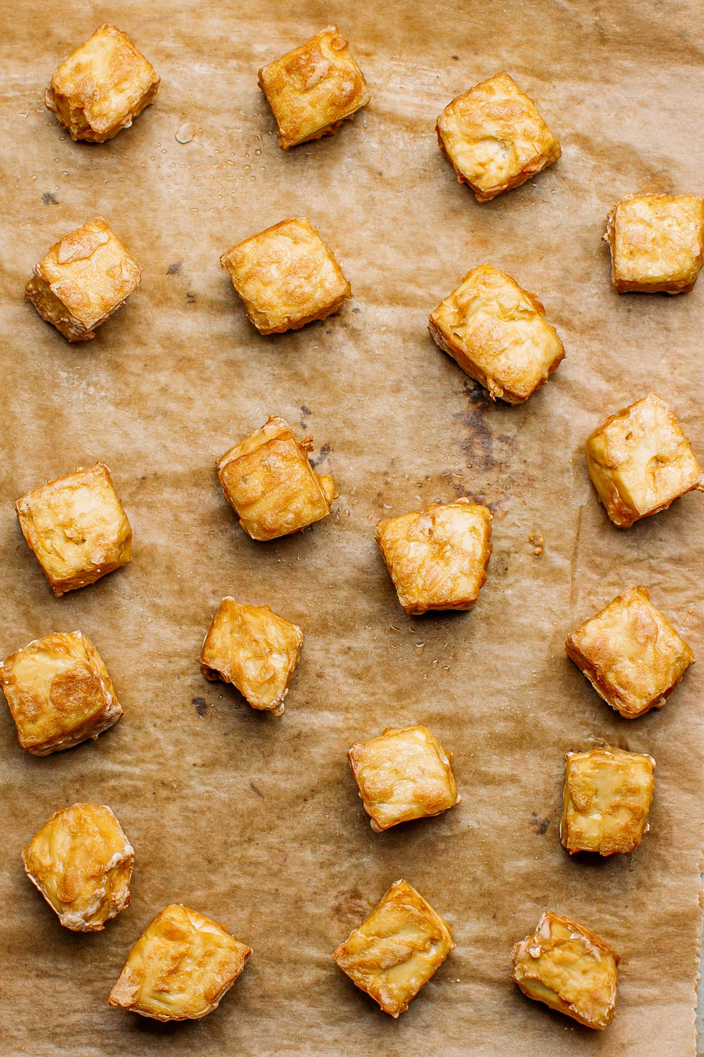 Baked tofu on a baking sheet.