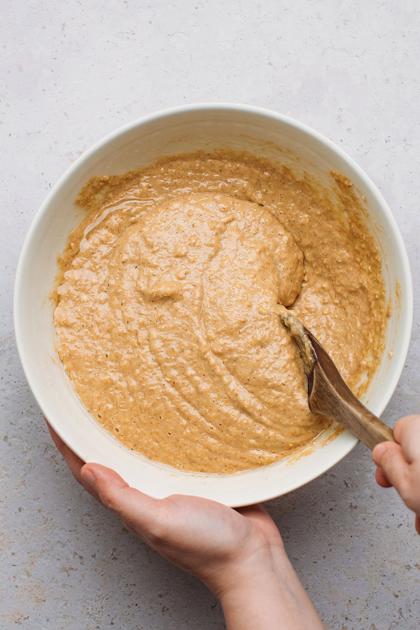 Banana cake batter in a mixing bowl.