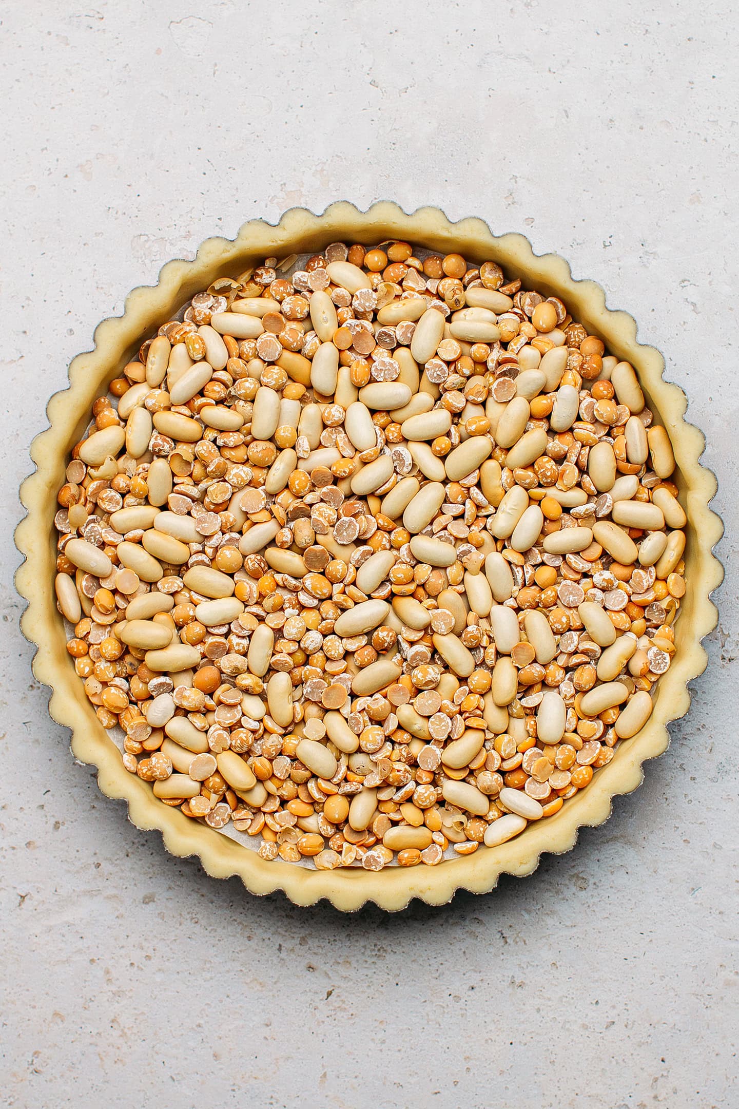 Pie crust topped with dried beans.