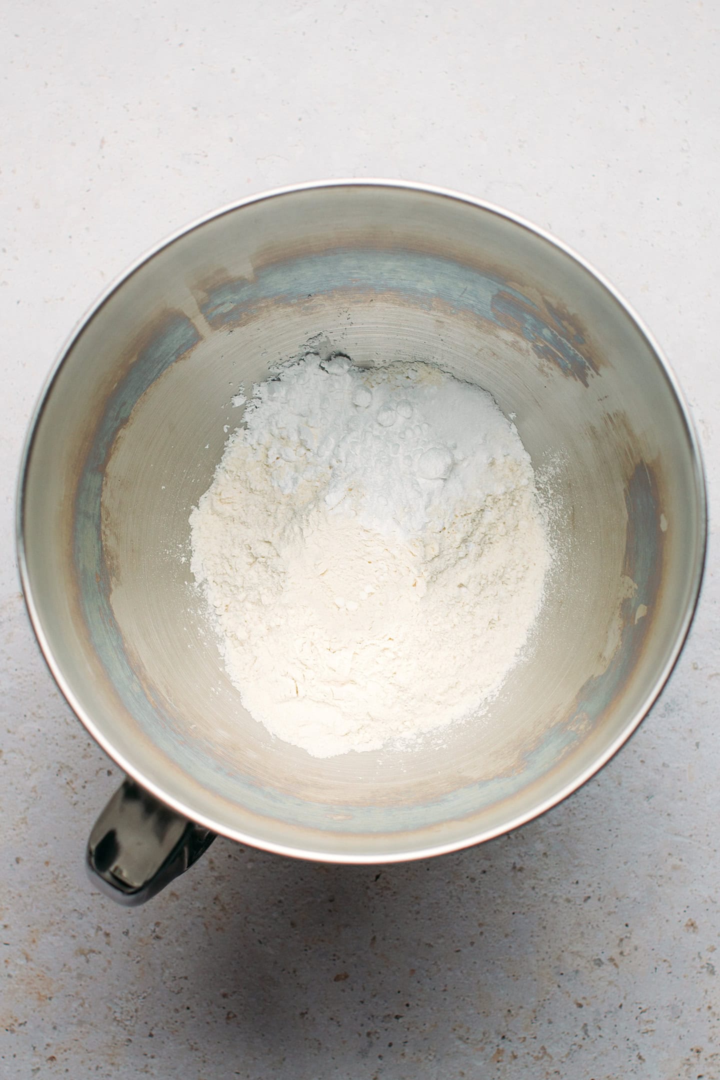 Flour and powdered sugar in a stand mixer.