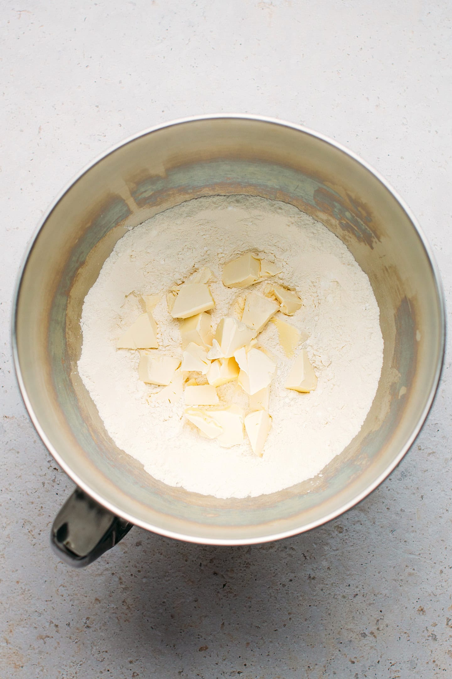 Flour and diced butter in a stand mixer.