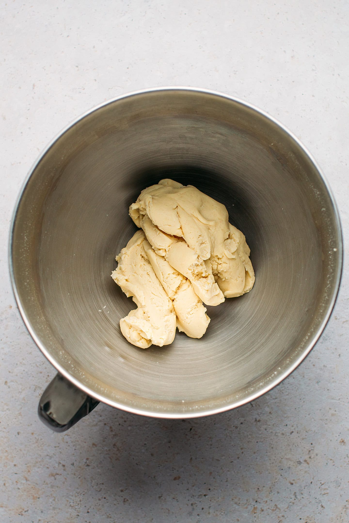 Shortcrust pastry dough in a stand mixer.