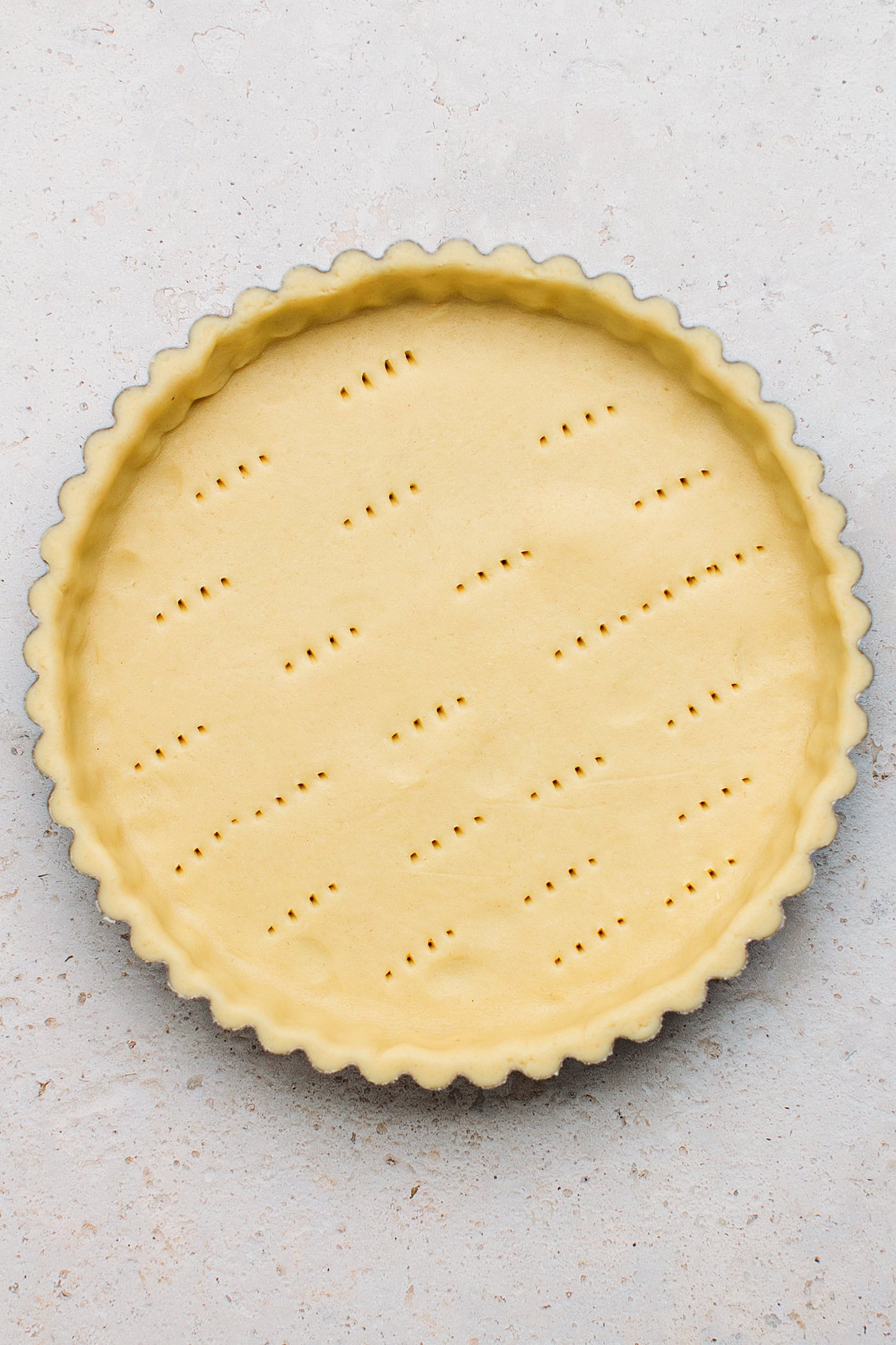 Shortcrust pastry pressed into a pie pan.